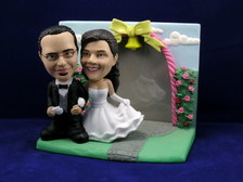 Bride and Groom Arm In Arm With Rose Garden Frame Bobblehead - Bobbleheads.com