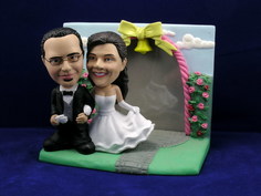 Bride and Groom Arm In Arm With Rose Garden Frame Bobblehead