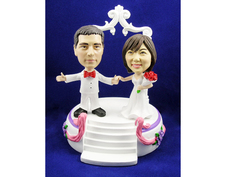 Bride and Groom Arms Outstretched On Stage Bobblehead